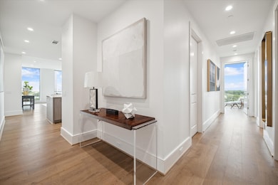 Featuring wide-plank hardwood floors and soaring c