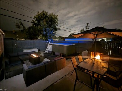 View of patio with a fire pit and a fenced in pool