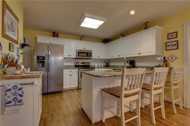 The cook will love preparing meals on the new custom granite countertops.