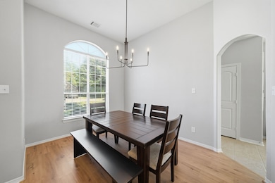 Formal dining room with access to the kitchen.