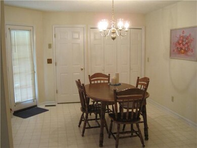 Breakfast/Dining room has lots of space for family and guests, and the laundry closet, plus exit door to the covered deck!
