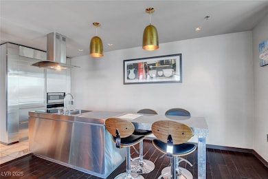 Kitchen with baseboards, decorative light fixtures