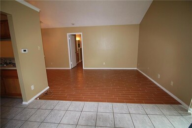 Empty room with baseboards and wood finished floo