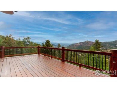 Massive deck with view of Estes Park, snow-capped mountains and 4th of July fireworks over Lake Estes