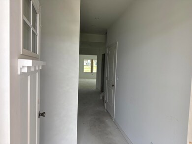 Hallway with concrete floors