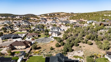 View of property location with a mountain backdrop and nearby suburban area