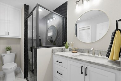 Bathroom featuring marble finish floor, toilet, va