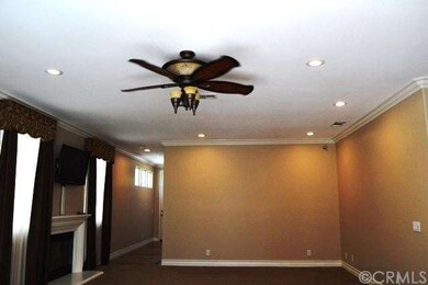 Recessed lighting and crown molding in living room