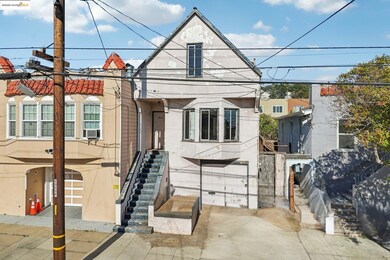 View of front of house featuring stairway and stucco siding