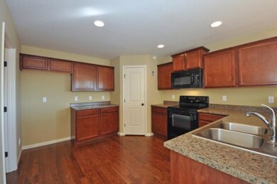 Kitchen with Hardwood floors