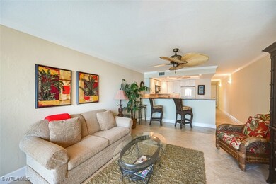 Tiled living room with ceiling fan and ornamental