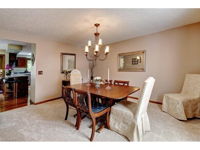 This formal dining space offers plush carpeting wi