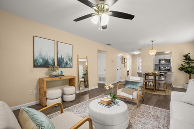 Living room with wood finished floors, baseboards