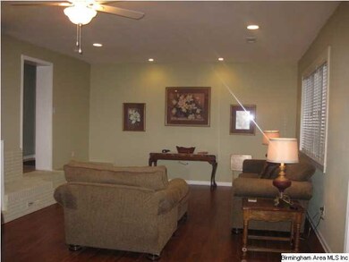 Living room has new hardwood floors and recessed l