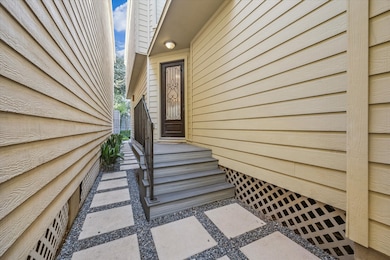 Refined hardscaping and synthetic decking are a value add for the entry to this home.