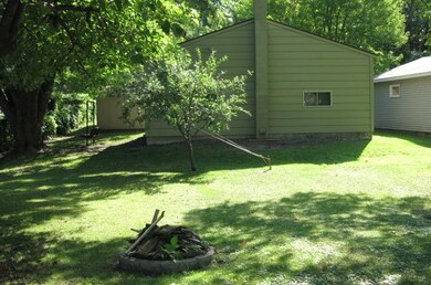 Another view of the backyard showing the garage an