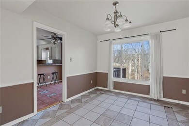 Dining Room with large window overlooking backyard