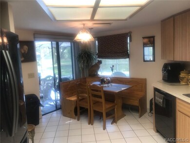 Eat in Kitchen with sliders to lanai & pool