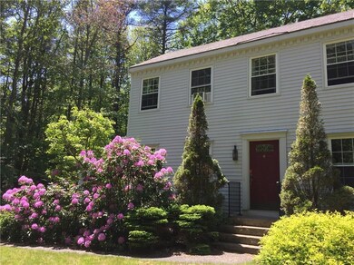 Mature perennials surround the home...