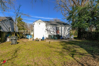 Back of property featuring a lawn