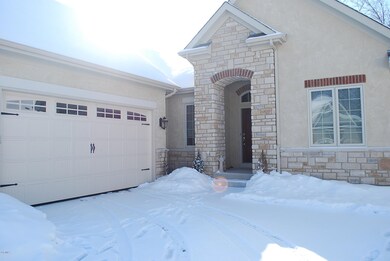 Front Door & Garage View