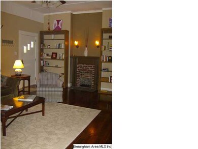 Fireplace flanked by built-in bookcases
