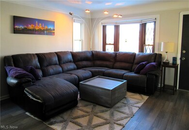 Living room with wood-type flooring