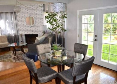 Dining room w/French doors to lush backyard
