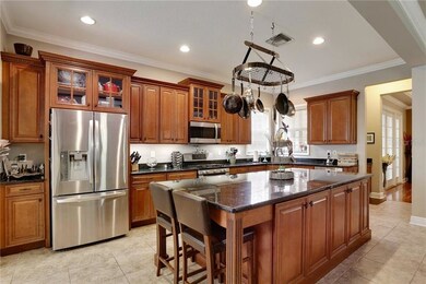Hardwood Cabinets feature Glass Display and Crown 