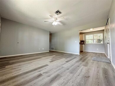 Spare room with ceiling fan, light hardwood / wood