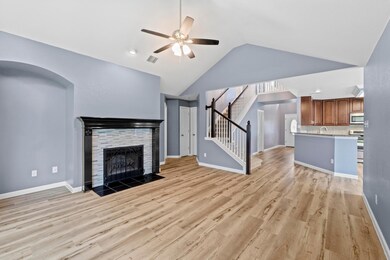 Unfurnished living room with ceiling fan, light w