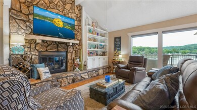 Large living area with floor to ceiling stone fire