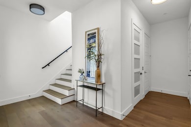 Iron Door keyless entry, wood flooring, Storage area, Entry Closet and Private Elevator.