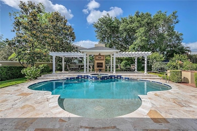 Swimming pool with a sun shelf surrounded by a block wall
