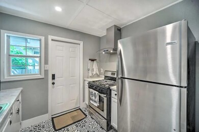 Kitchen featuring baseboards, tile patterned floo