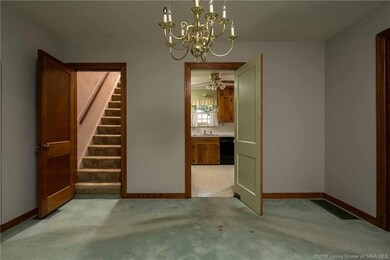 Stairs lead to second floor master