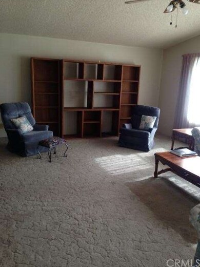 Another view of living room. Entertainment unit in