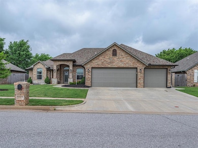 French country style house featuring roof with shingles, a garage, driveway, and brick siding