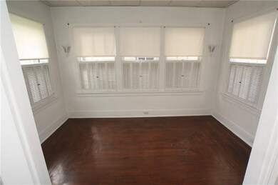 Completely enclosed sun room with stylish shutters