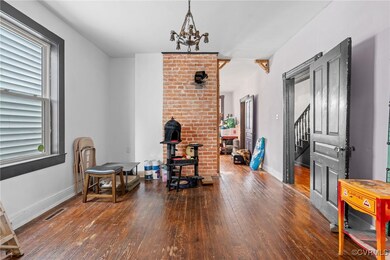 Living area with dark hardwood / wood-style floori