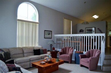 Living room with arched windows.