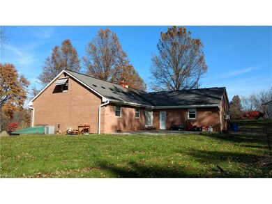 View of the back of the home and the patio area. B