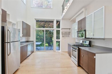 Through the kitchen is the large sliding glass doo