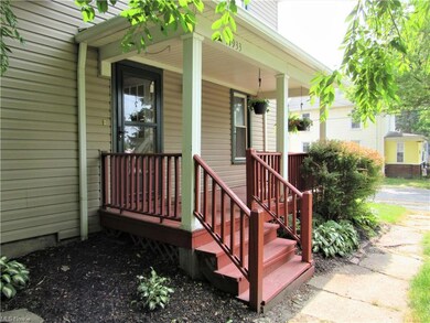 Sharp, neat landscaping welcomes you to the cozy f