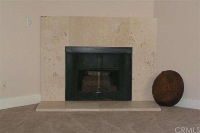 Fireplace in living room feature stone surround.