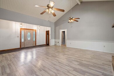 Front door opens to the spacious living!