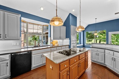 Large kitchen has ample cabinet and counter space.