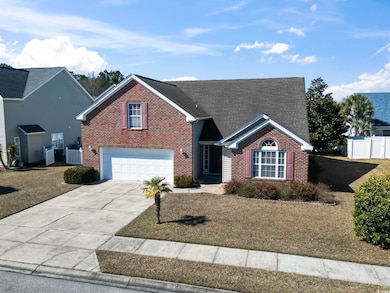 Traditional-style house featuring brick siding, a 
