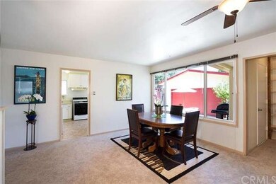 Dining room with entrance to kitchen with large wi