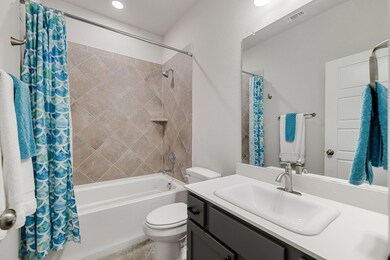 First level full bathroom featuring vanity, shower